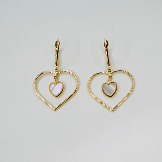 Very stylish and elegant, these heart earrings are crafted in highly polished 14K yellow gold and also include a miniature mother-of-pearl heart in the center. fin. These earrings are the perfect mix of stylish and chic, amazing for every day wear. 
The pair weighs 2.5 grams.
An earring measures 1.25 inches long
FREE leatherette jewelry box.
Made in Italy.