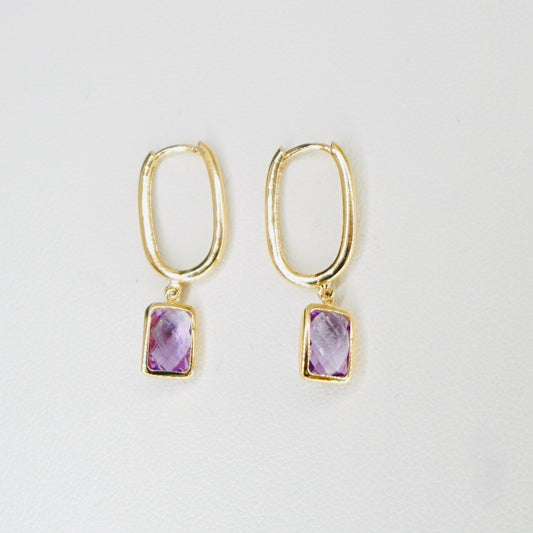 Very stylish and elegant, these dangling earrings are crafted in high-quality 14K yellow gold with the stone featured being amethyst. These earrings are the perfect mix of stylish and chic, amazing for everyday wear. 
A pair weighs 2.5 grams 
One earring measures 1 inch long.
FREE USPS Priority Mail shipping!
FREE leatherette jewelry box!
Made in Italy. 
