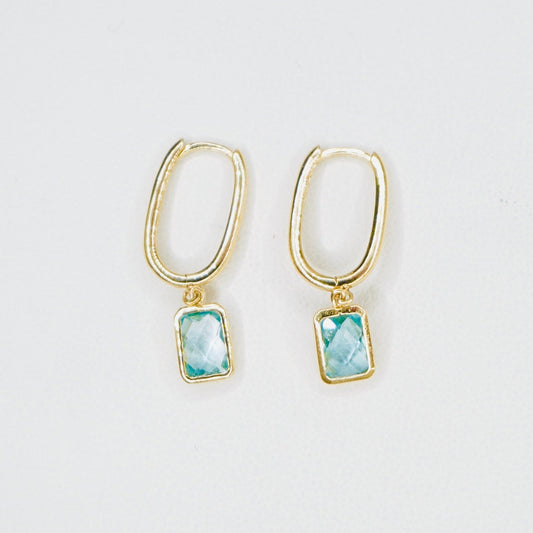 Very stylish and elegant, these dangling earrings are crafted in high-quality 14K yellow gold with the stone featured being aquamarine. These earrings are the perfect mix of stylish and chic, amazing for everyday wear. 
A pair weighs 2.5 grams 
One earring measures 1 inch long.
FREE USPS Priority Mail shipping!
FREE leatherette jewelry box!
Made in Italy. 