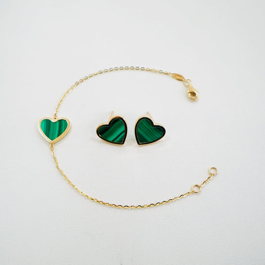 Fall in love with timeless elegance. Handcrafted in Italy from genuine 14K yellow gold, this dainty heart bracelet and earrings feature a delicate heart charm with the famous malachite stone. Lightweight and effortlessly chic, it’s the perfect everyday luxury piece that layers beautifully or stands stunningly on its own. 
The bracelet measures 7 inches long
The bracelet and earrings weigh 4.5 grams 
Made in Italy.
All orders ship within 24 hours!
FREE leatherette jewelry box!
FREE USPS Priority