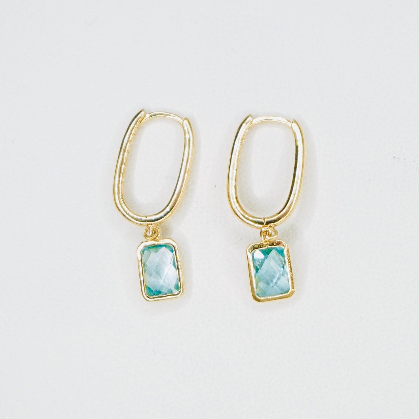 Very stylish and elegant, these dangling earrings are crafted in high-quality 14K yellow gold with the stone featured being aquamarine. These earrings are the perfect mix of stylish and chic, amazing for everyday wear.&nbsp;

A pair weighs 2.5 grams&nbsp;

One earring measures 1 inch long.

FREE USPS Priority Mail shipping!

FREE leatherette jewelry box!

Made in Italy.&nbsp;